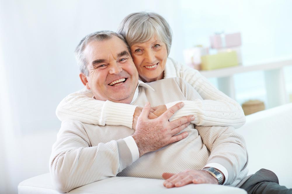senior couple smiling with upper dentures