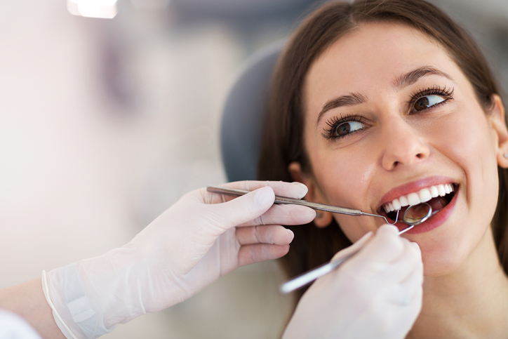 smiling patient in dental chair
